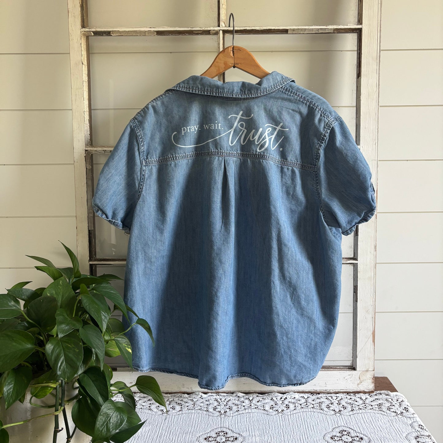 Pray wait trust on denim shirt