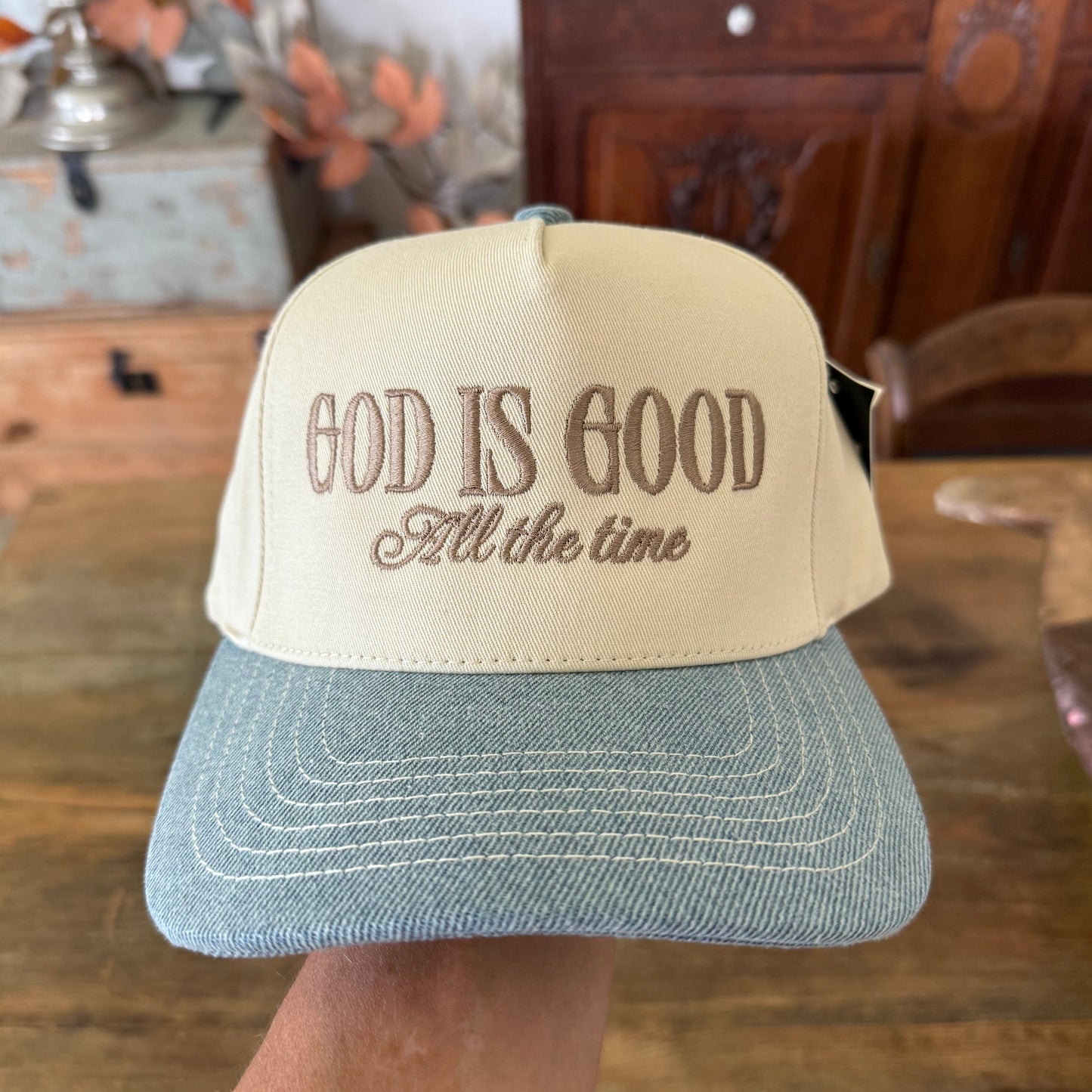 Beige cap with 'God is Good All the Time'