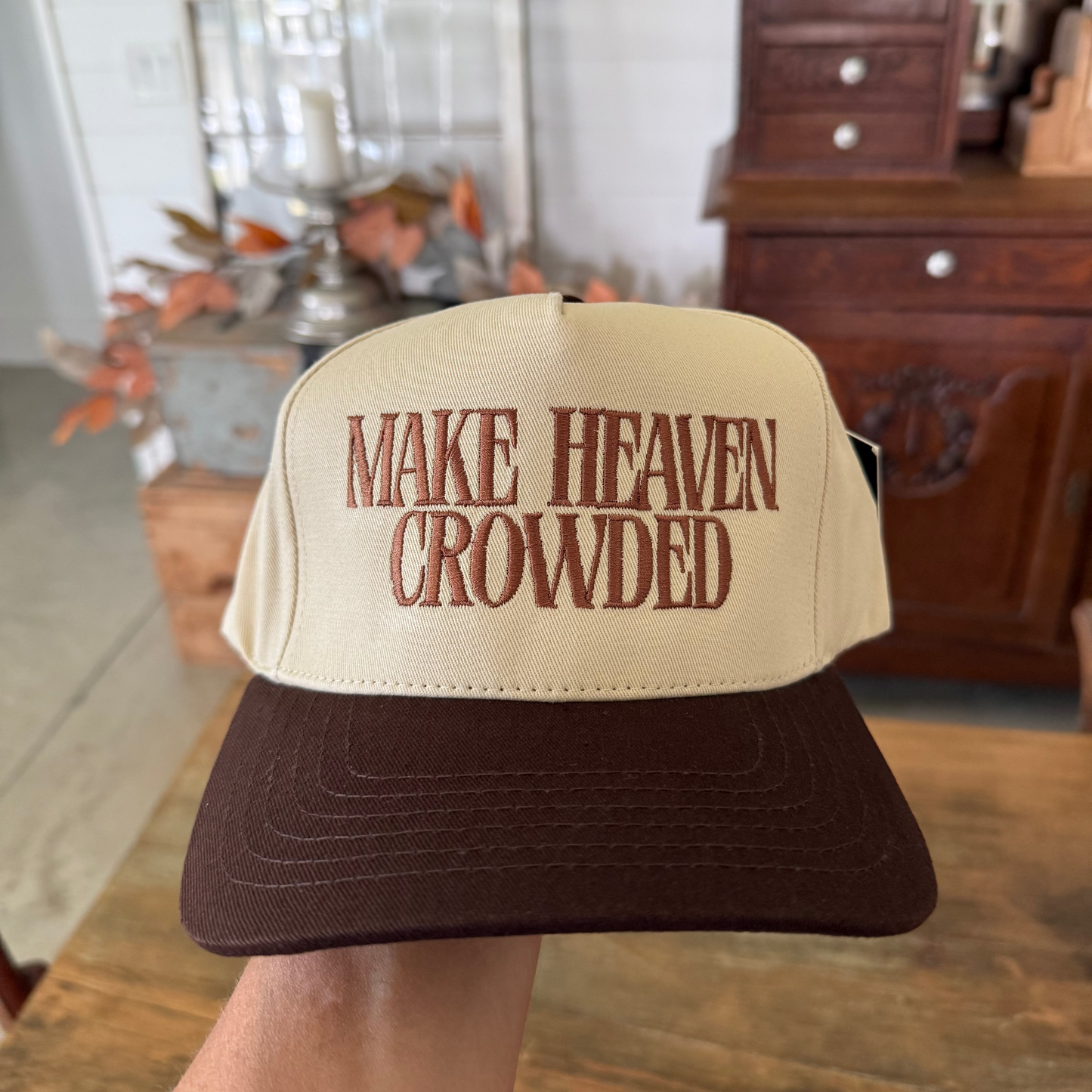 Beige and brown cap with 'MAKE HEAVEN CROWDED' text