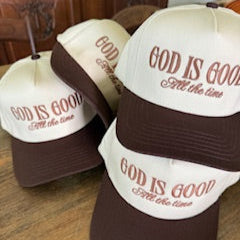 hat with 'God is Good all the time' embroidered on it